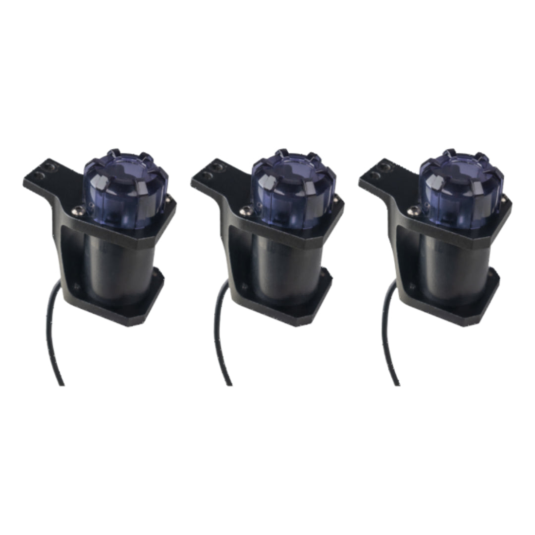 Three black mechanical components with clear nozzles on a white background
