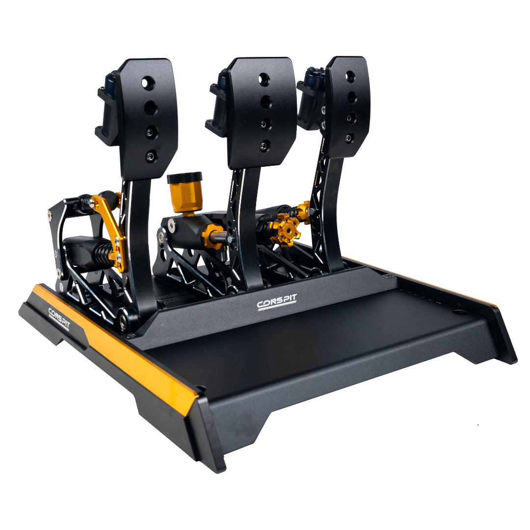 Black and yellow racing simulator pedal set on a white background