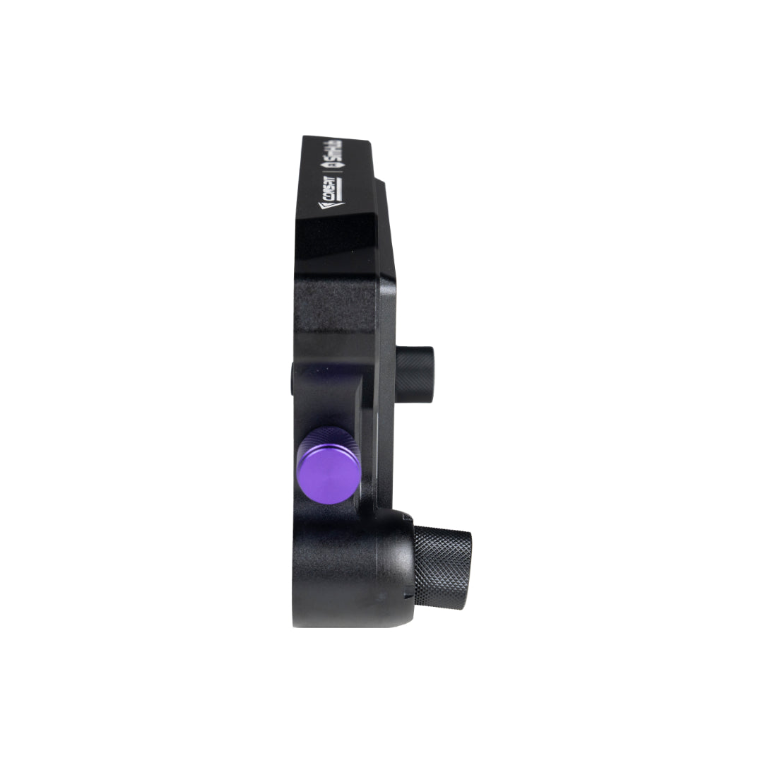 Black mechanical component with a purple button on a white background