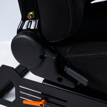 Close-up of a black car seat with a metallic armrest and orange lever on a light gray background