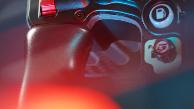 Close-up of Gomez Sim Industries sim racing steering wheel with illuminated controls and premium materials