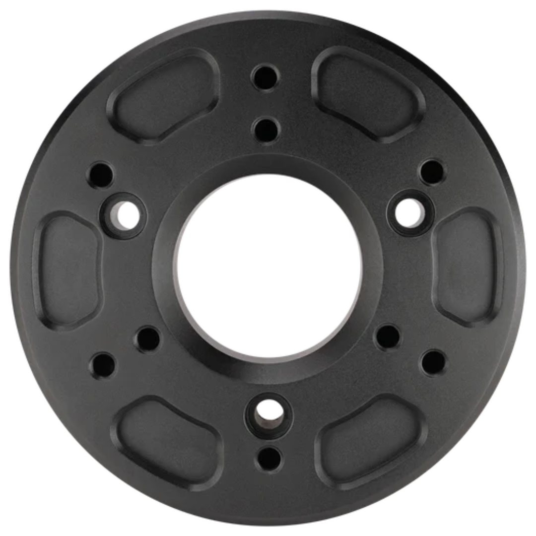 Black circular mechanical component on a white background