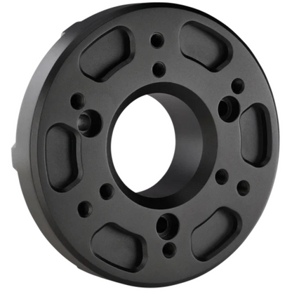 Black circular mechanical component on a white background