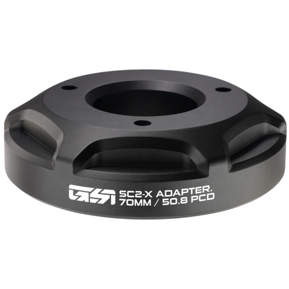 Black adapter with 'SC2-X' branding on a white background
