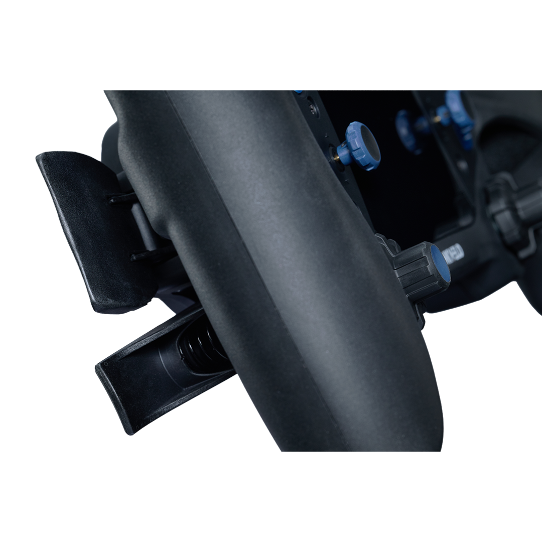Close-up of a black motorcycle exhaust system on a white background