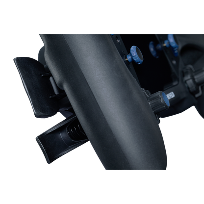 Close-up of a black motorcycle exhaust system on a white background