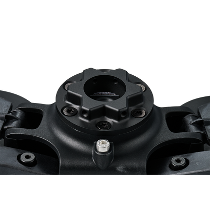 Close-up of a black mechanical component on a white background
