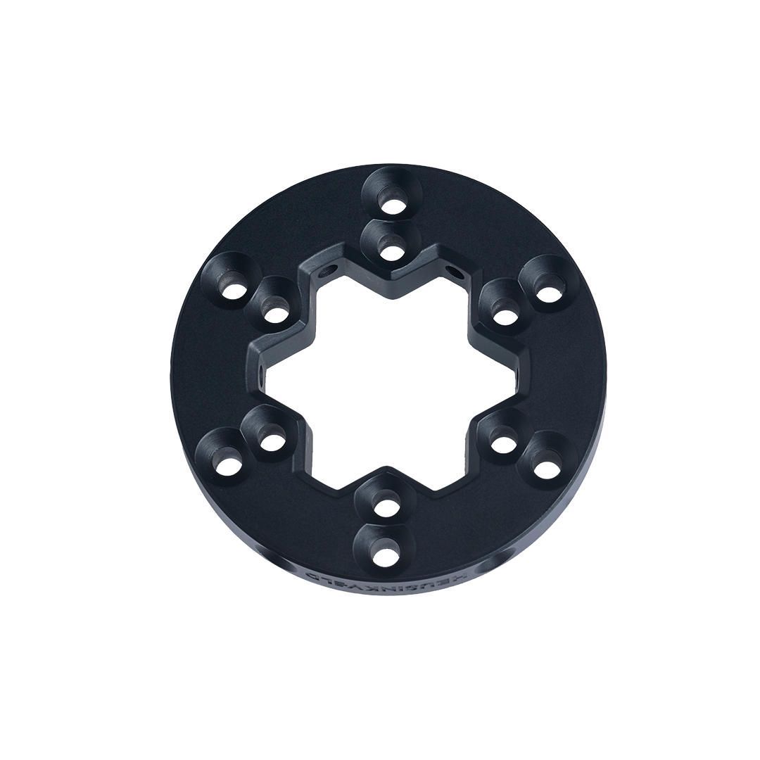 Black metal ring component on a white background