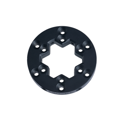 Black metal ring component on a white background