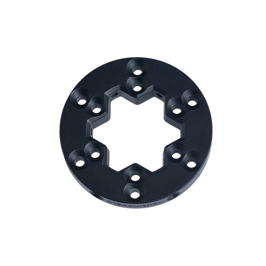 Black metal ring component on a white background