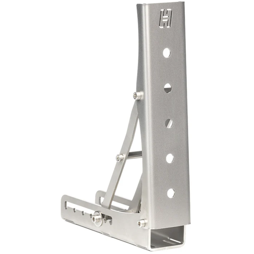 A silver stainless steel Heusinkveld Rest Pedal with multiple adjustment holes, designed for use with racing simulators.