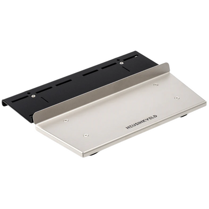 A silver and black Heusinkveld baseplate for mounting Sprint pedals, featuring a rigid mounting platform with an adjustable heel plate.