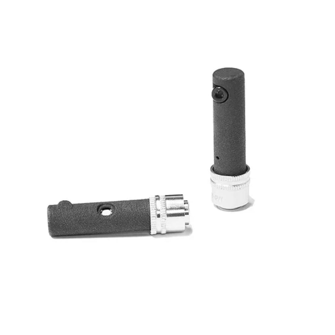 A black LeoXZ XS9 Dongle with metallic components, designed for enhancing the functionality of specific steering wheels in gaming setups.