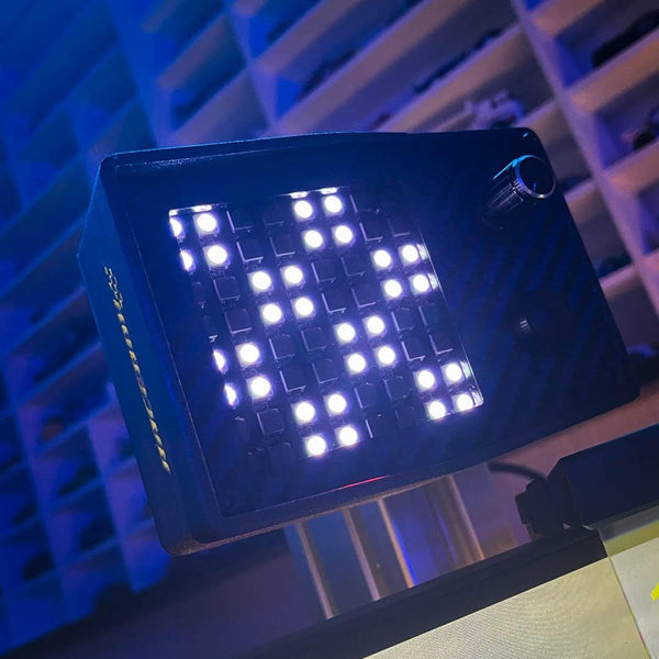 LED light panel with digital display on a blurred background