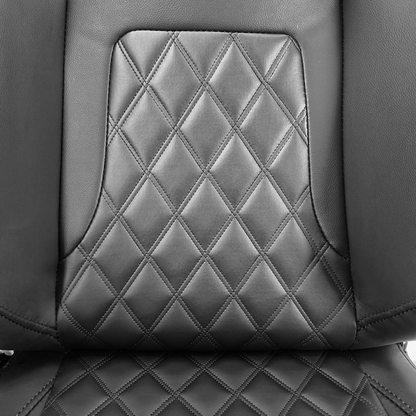 Close-up of Sim Motion black leather racing seat featuring diamond-quilted stitching on the seat base and backrest.