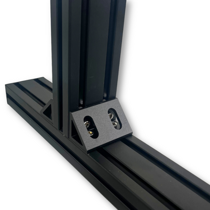 Close-up of a black metal bracket on a white background