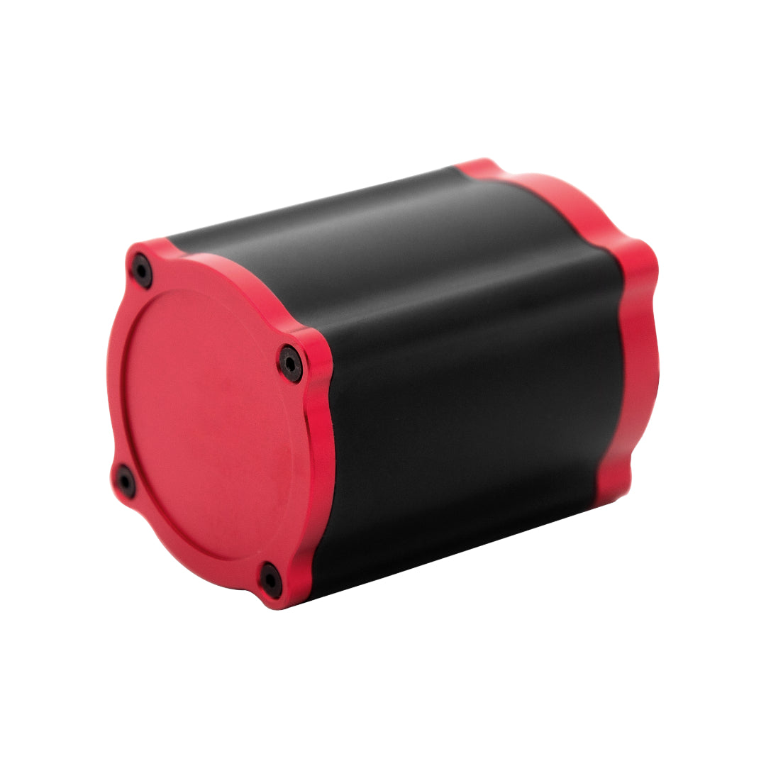 A Simagic Haptic Pedal Reactor with a cylindrical black and red body, accompanied by a power supply and cables.