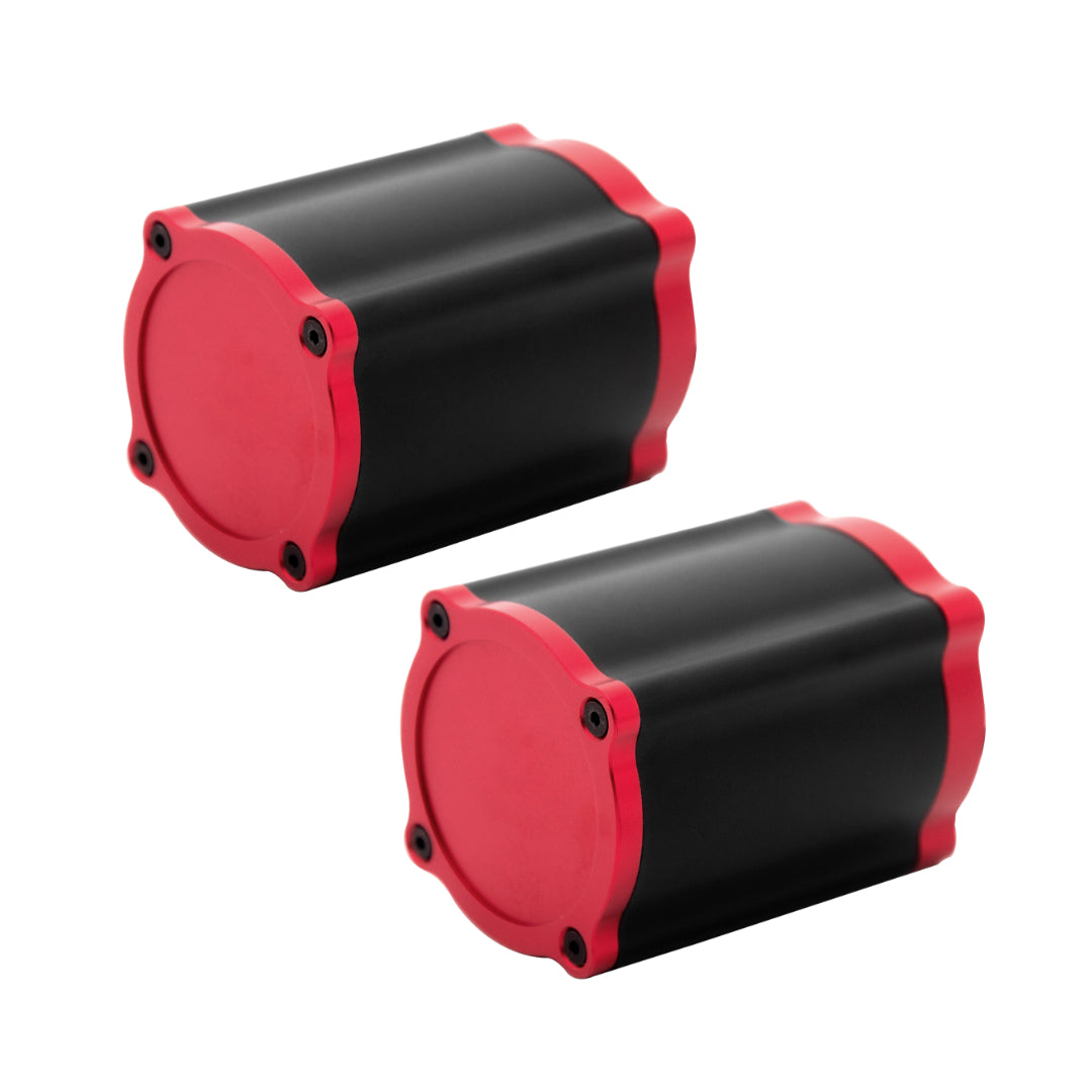 A Simagic Haptic Pedal Reactor with a cylindrical black and red body, accompanied by a power supply and cables.