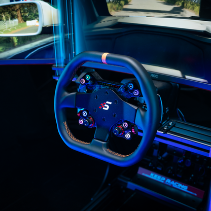 Steering wheel with illuminated buttons in a vehicle interior