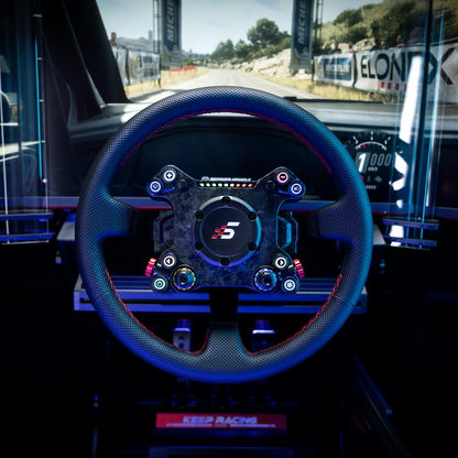Steering wheel with a logo in a car interior, likely on a race track.