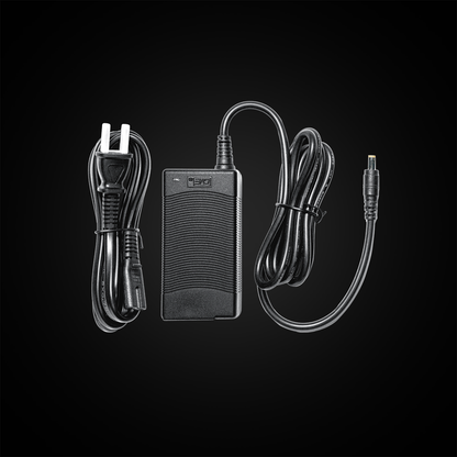 Black power adapter with cables on a black background