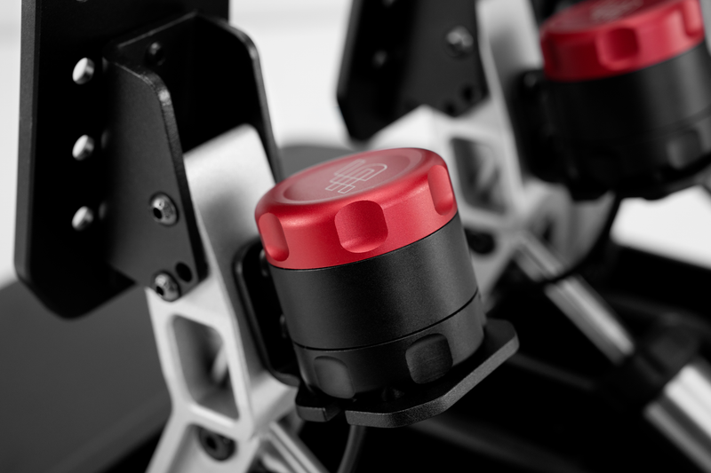 Close-up of a red and black button on a mechanical device