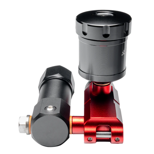 A hydraulic upgrade kit consisting of a black and red pedal and a black hydraulic cylinder, likely made of metal and plastic components.
