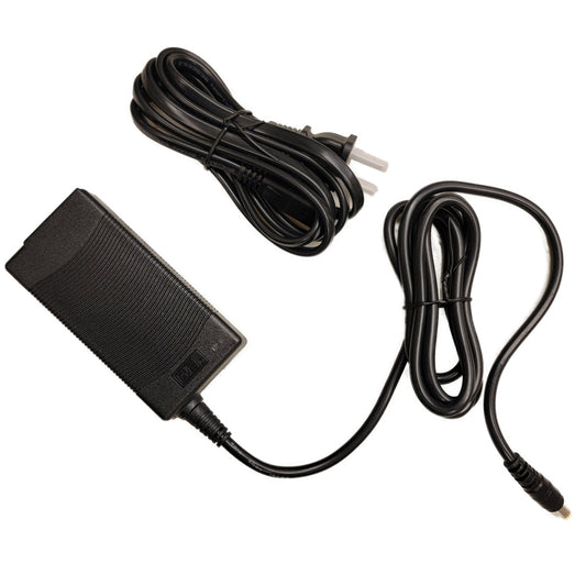 A black power supply unit and cable for Simagic P1000 / P2000 pedal sets.
