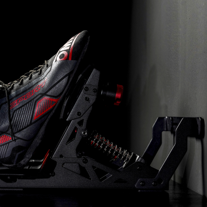 Black and red hockey skate with visible branding on a dark background