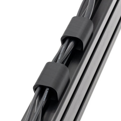 Close-up of a cable with black connectors on a white background