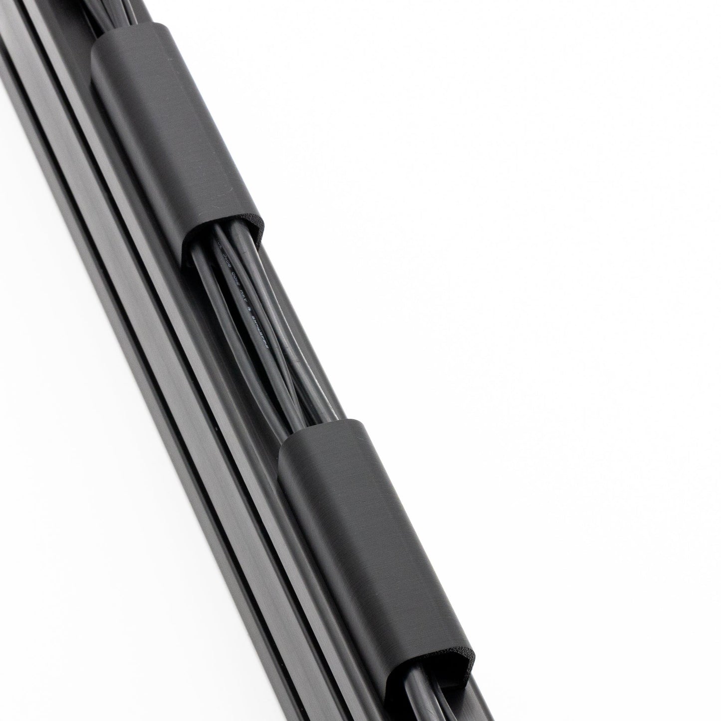Close-up of a car windshield wiper blade on a white background