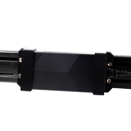 Close-up of a black metal component on a white background