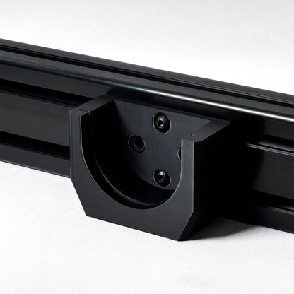 Close-up of a black metal roof rack on a white background