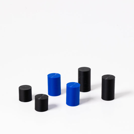 Set of black and blue cylindrical objects on a white background