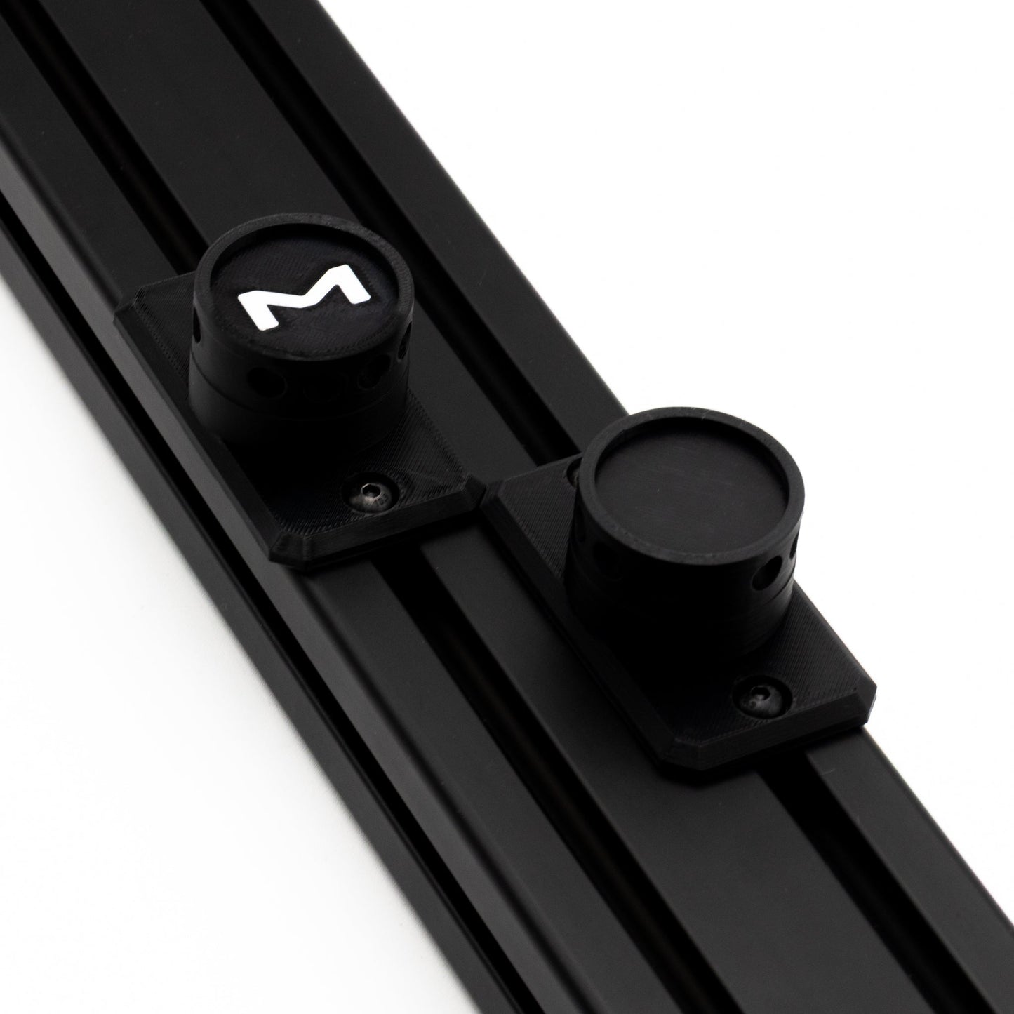 Black metal rod with cylindrical components and a logo on a white background