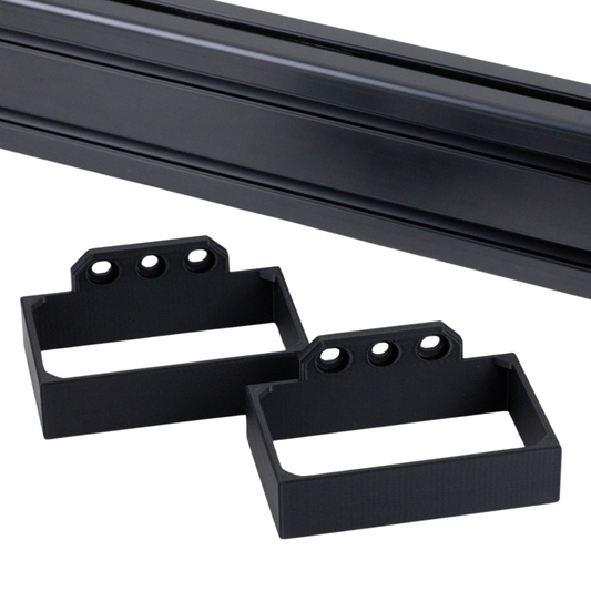 Black metal brackets on a white background