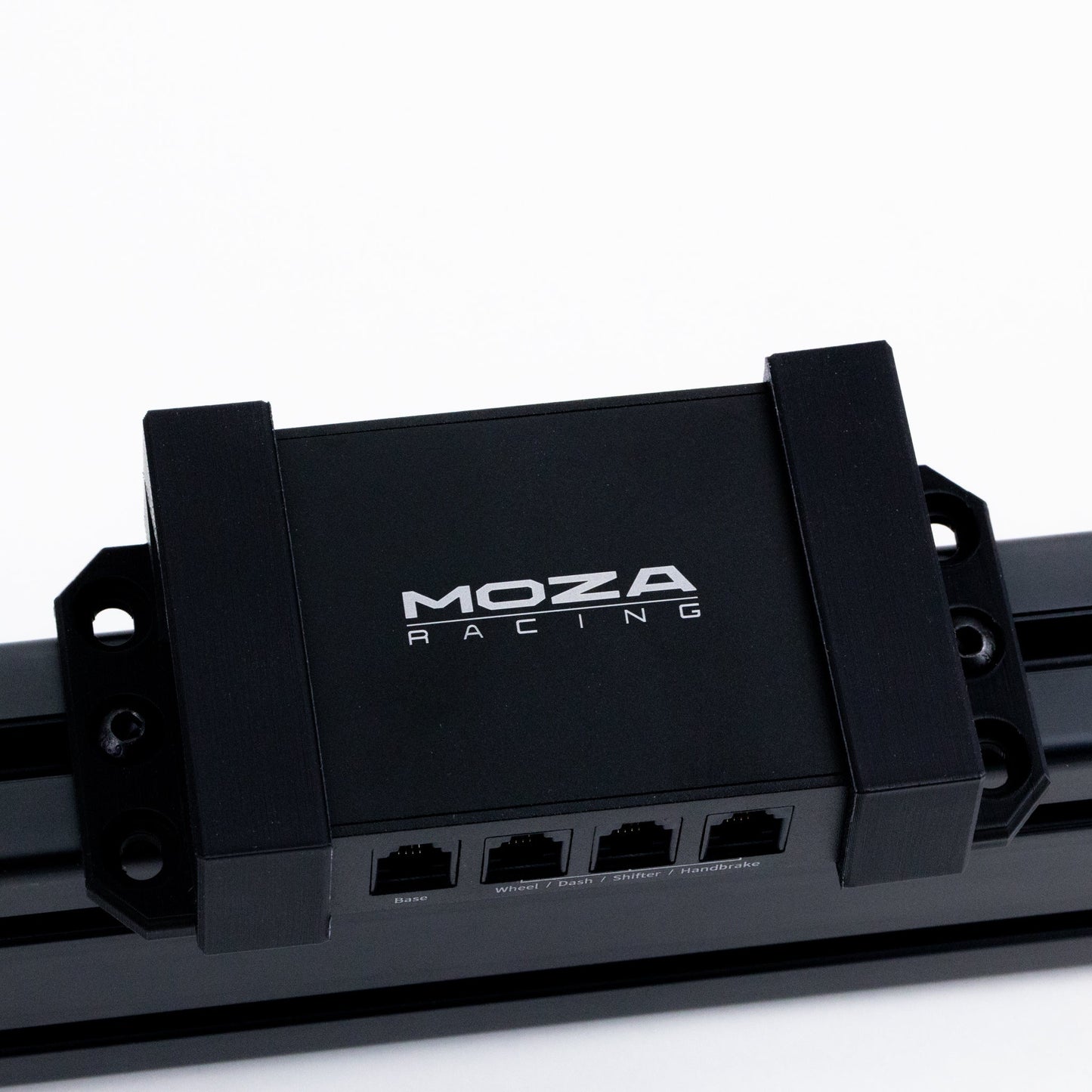 Black electronic module with 'Moza Racing' logo on a white background