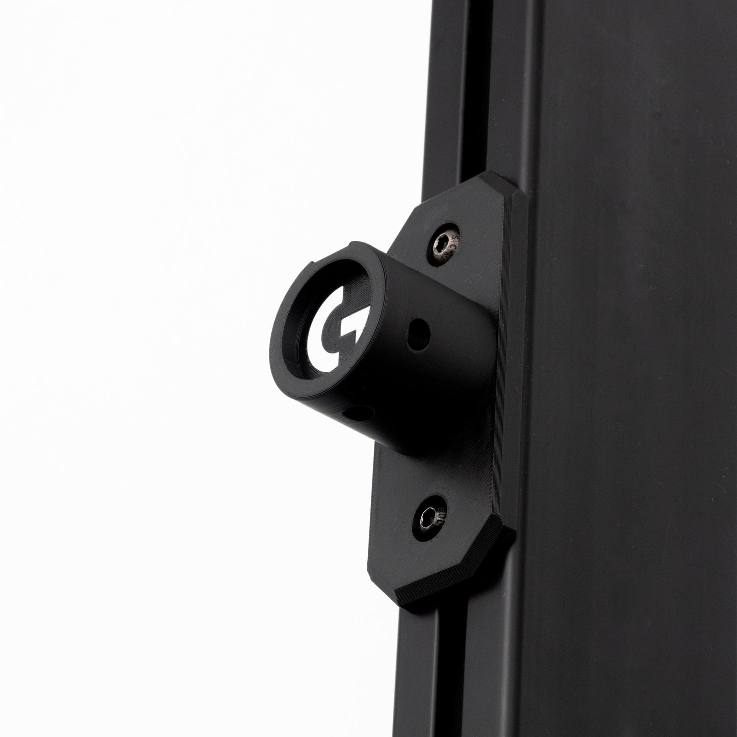 Close-up of a black metal bracket on a white background