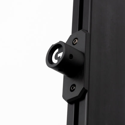 Close-up of a black metal bracket on a white background