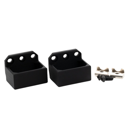 Two black wall mount brackets with screws on a white background