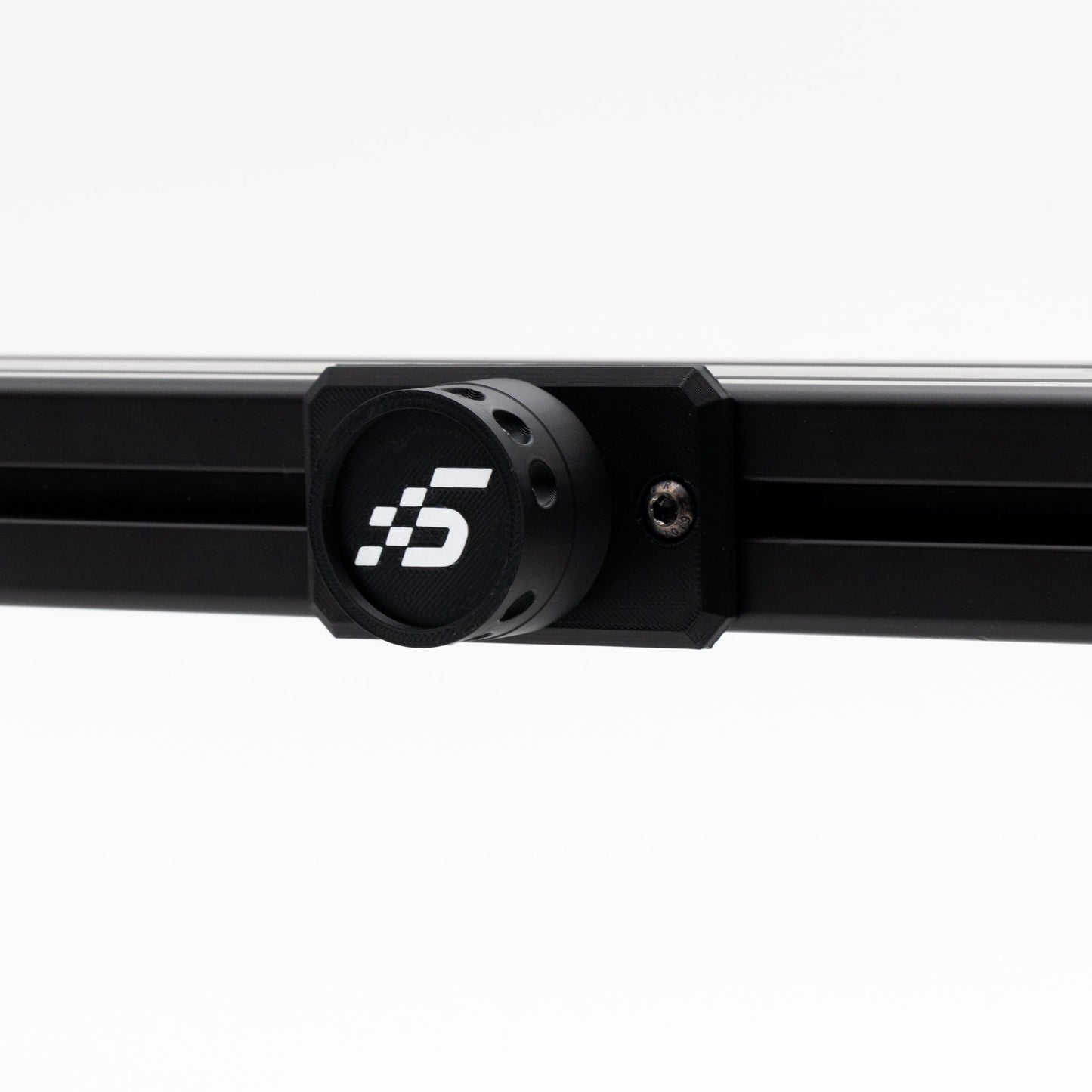 Black metal rod with a circular component featuring a logo on a white background
