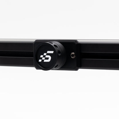 Black metal rod with a circular component featuring a logo on a white background