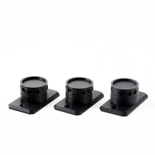 Three black camera lens hoods on white background