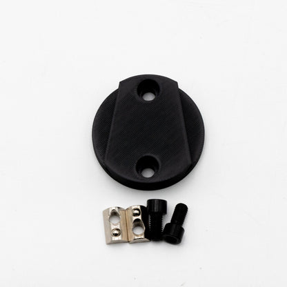 Black plastic cap with screws on a white background