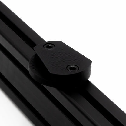 Close-up of a black metal rod with a clamping mechanism on a white background
