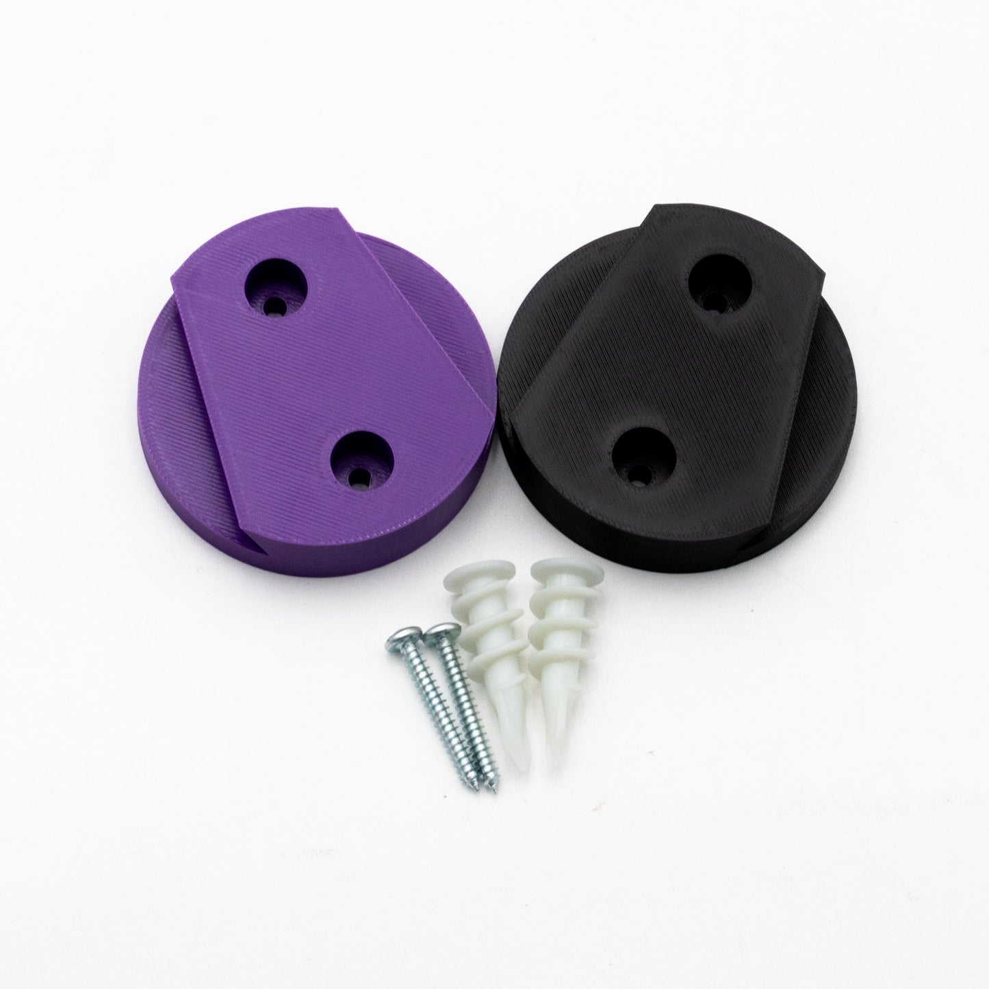 Purple and black circular components with screws on a white background
