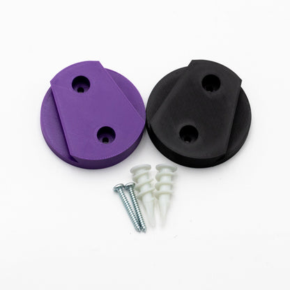 Purple and black circular components with screws on a white background