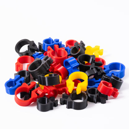 Assorted colorful plastic clips on a white background