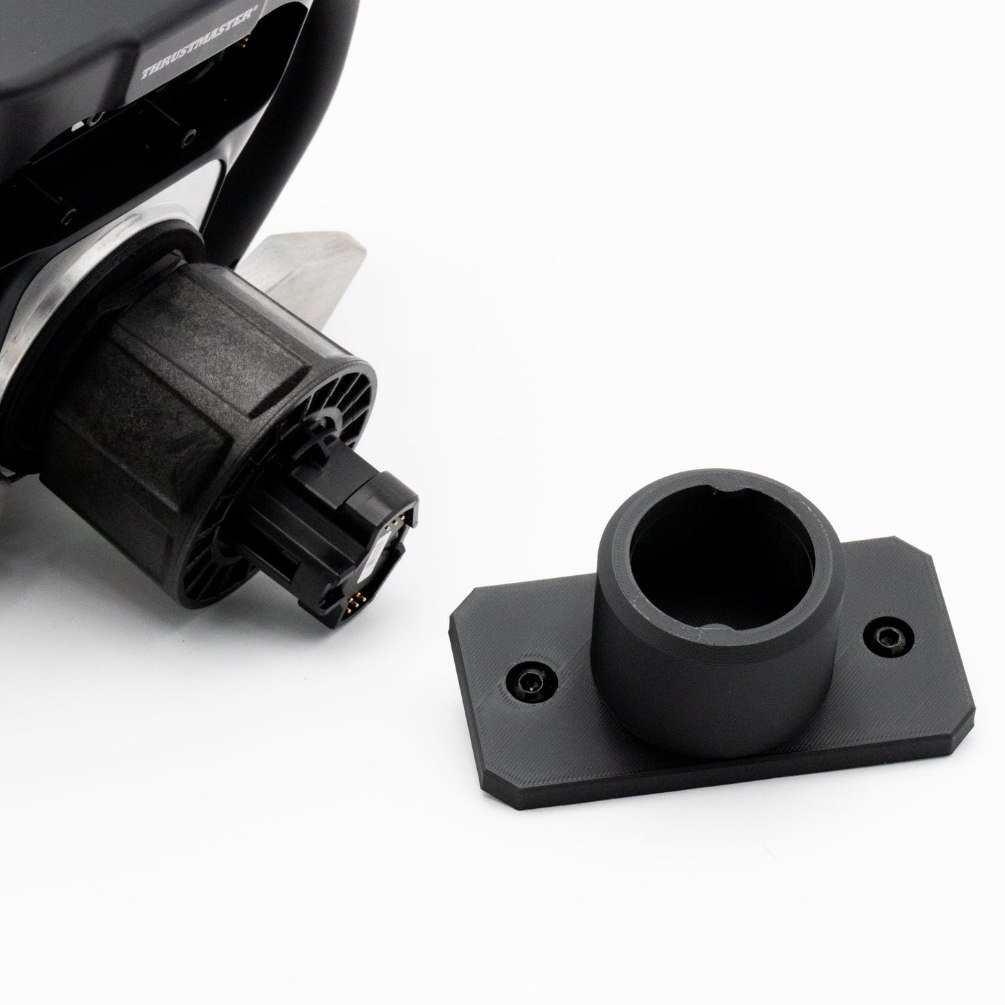 Close-up of a black motorcycle headlight assembly on a white background