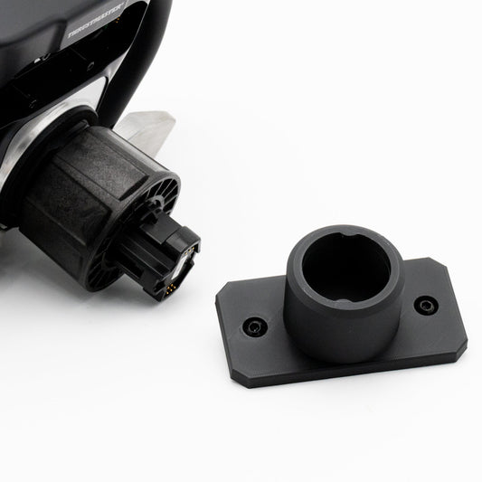 Close-up of a black motorcycle headlight assembly on a white background